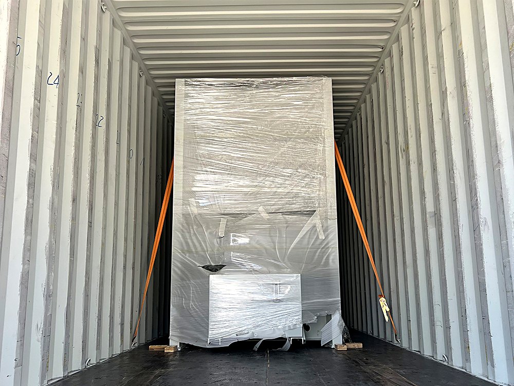 WFSEN hot press machine packed and secured inside a shipping container