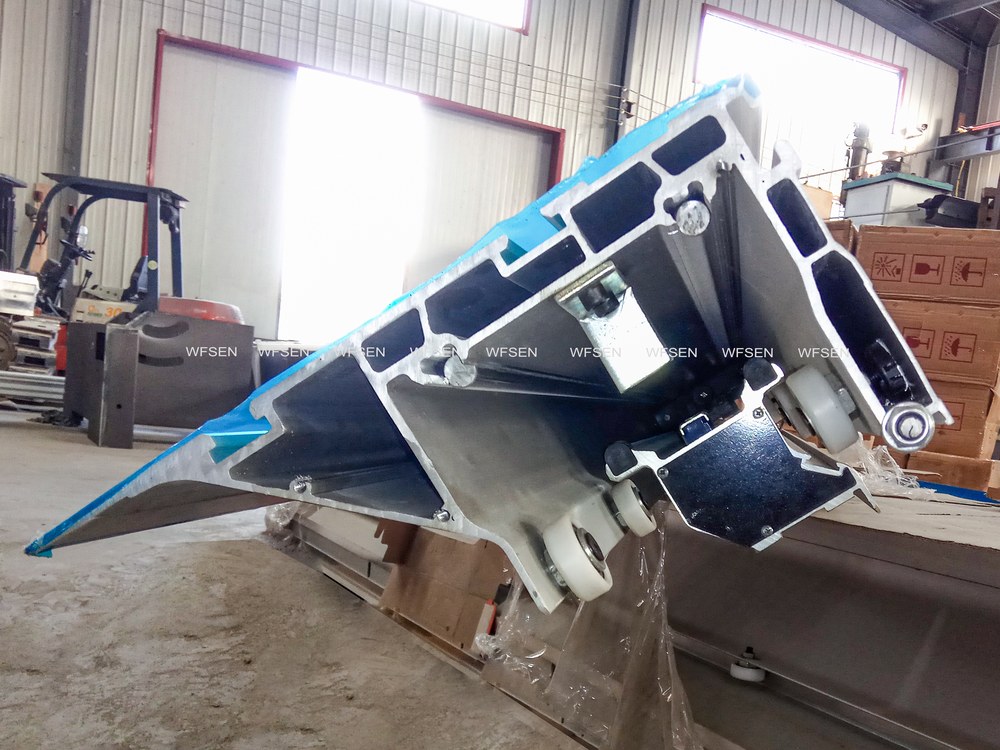 Saw unit of a sliding table saw, shown with the blade assembly and the sliding carriage rails