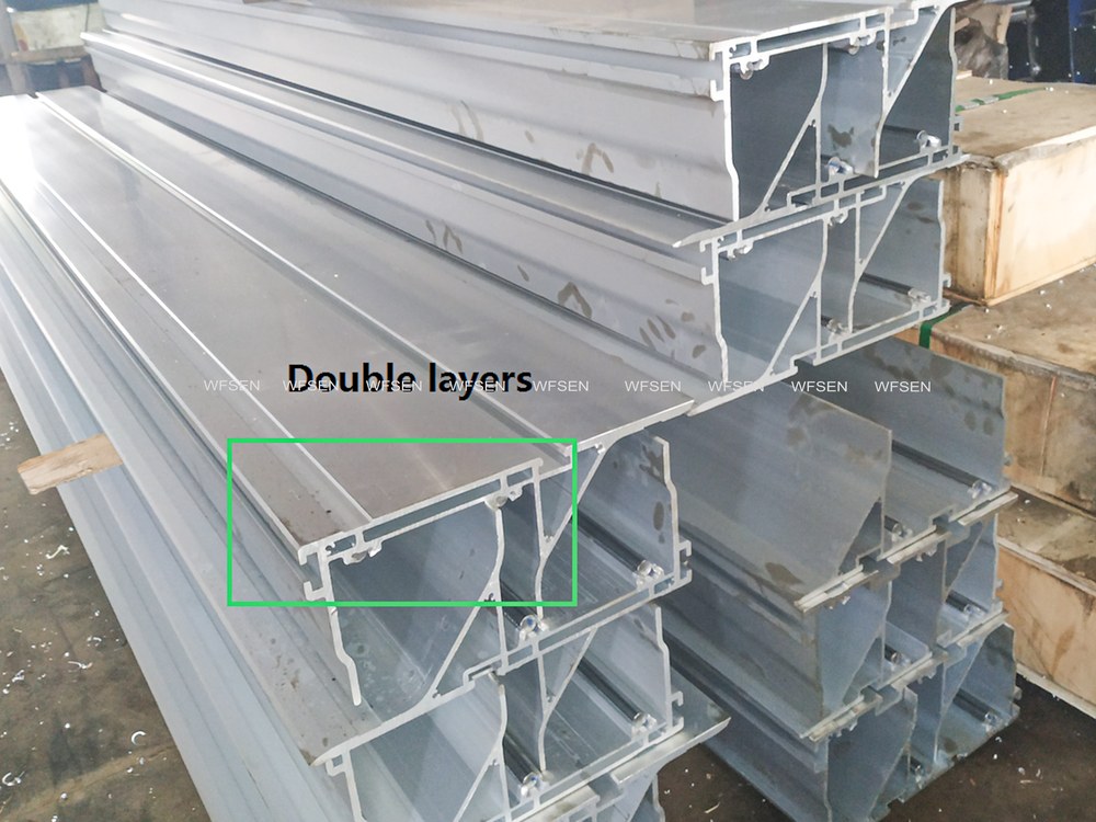 Aluminium sliding table profile shown in section, annotated as a double-layer construction