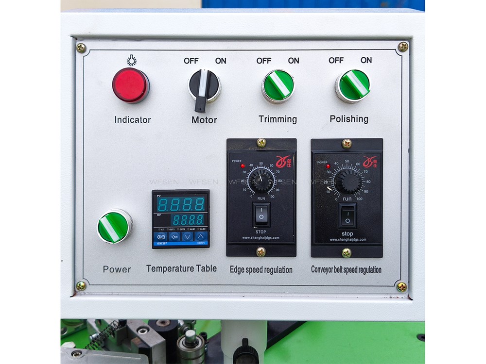 Control panel of a manual edge banding machine: power indicator, motor, trimming and polishing switches, temperature table, edge speed and conveyor belt speed regulators
